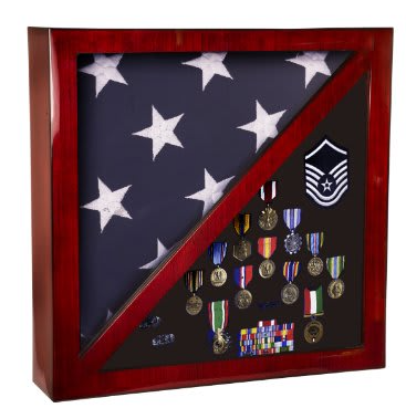Cherry-finished wooden shadow box display case featuring a triangular folded American flag on the left side and an arrangement of military medals, ribbons, and insignia on the right side.