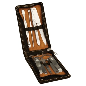 Complete grooming tool kit featuring various stainless steel tools, neatly organized in a compact case for travel and convenience.
